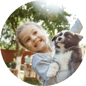 girl hugging dog